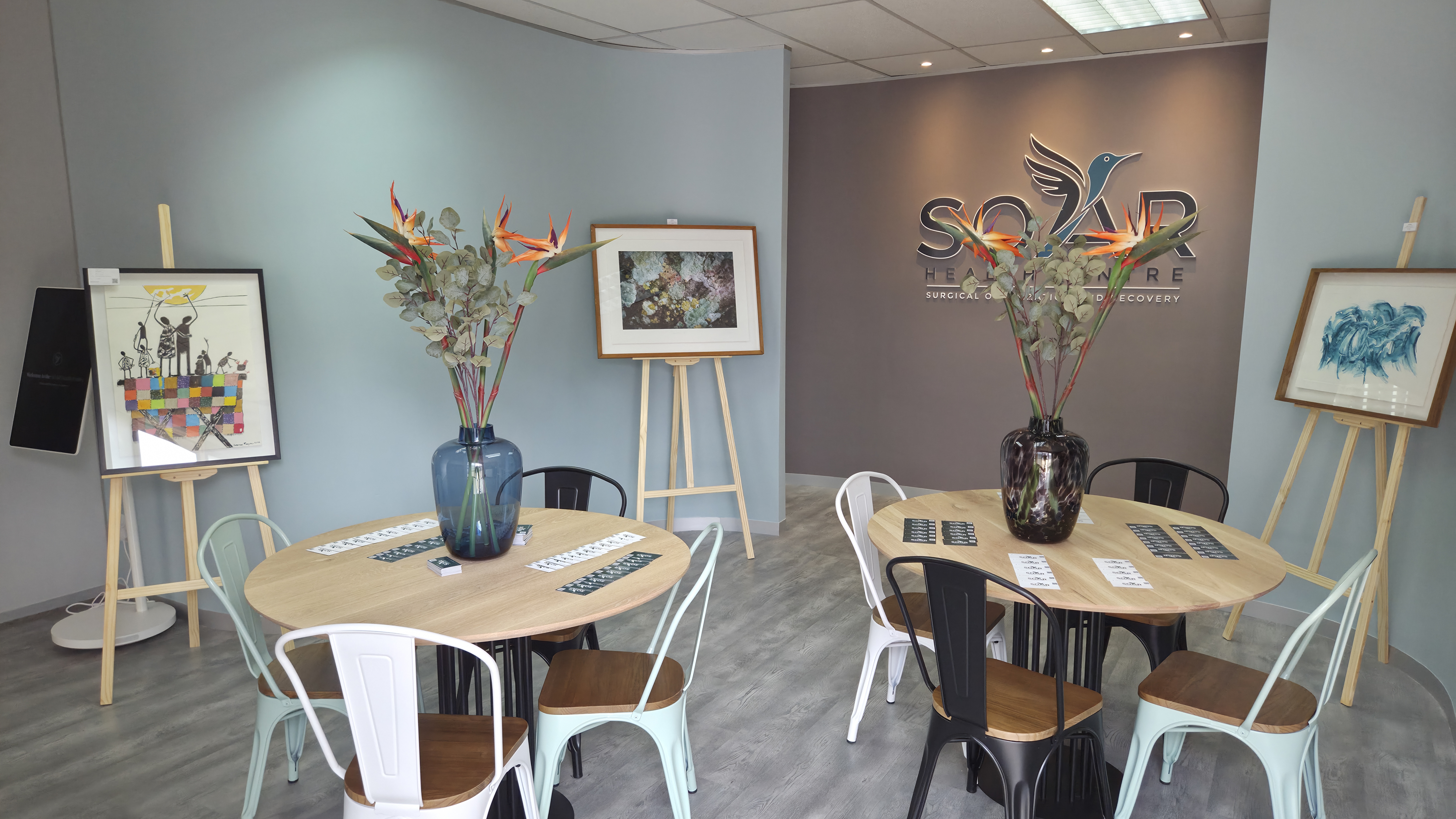 SOAR Health Centre welcome lounge with round tables